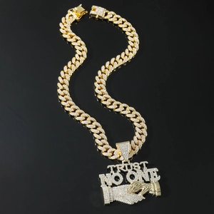 Iced out gold Cuban link chain with Trust No One handshake pendant for hip-hop style
