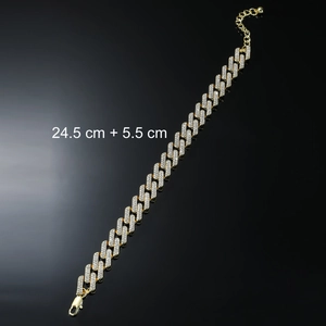Detail of gold Cuban link anklet with rhinestones featuring lobster clasp and extension
