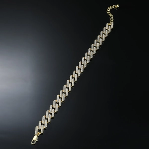 Close-up of gold plated Cuban link bracelet with full rhinestones and lobster clasp detail