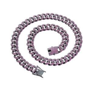 Detail of gunmetal Cuban link chain with pink rhinestones and a crystal-encrusted clasp