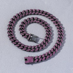 Detail of iced-out Cuban link chain with purple rhinestones and secure clasp