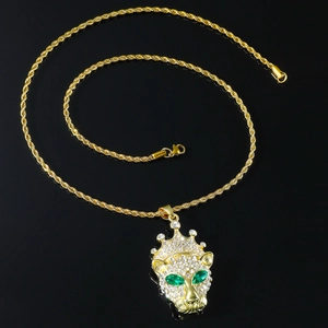 Macro shot of hip hop crown leopard pendant with green eyes and rope chain details