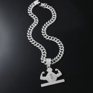 Macro view of iced-out Cuban chain and muscular money bag pendant with dollar sign