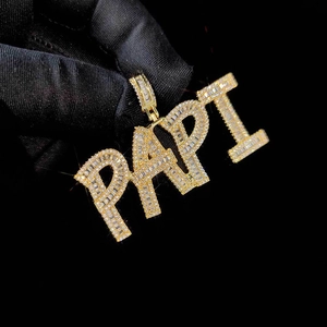 Close-up of iced-out PAPI square letter pendant with gold plating and zircons