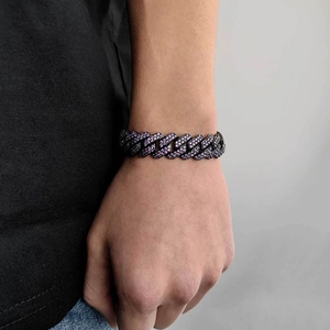 Detail of 15mm hip hop Cuban link bracelet featuring purple and white zircon inlay