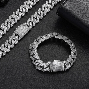 Detail of 15mm iced out silver Cuban link chain and bracelet with pave zircon stones