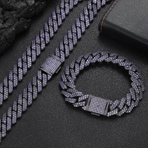 Close-up of hip hop Cuban link jewelry set with purple zircons and gunmetal plating