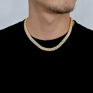 Detail of 8mm gold Cuban link chain with paved zircons worn by male model