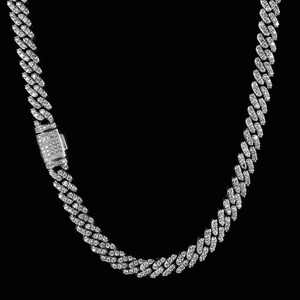 Macro shot of 8mm silver Cuban link chain featuring iced out zircons and secure buckle