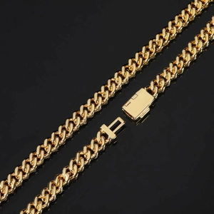 Macro shot of 8mm gold cuban link chain with high-polished box clasp mechanism details