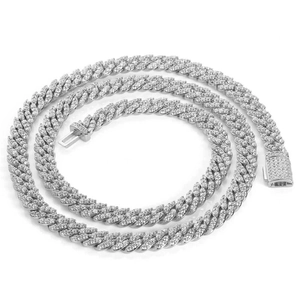Macro detail of 8mm silver Cuban link necklace with iced-out micro-pave zircons