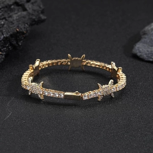 Hip hop style gold barb wire tennis bracelet with cubic zirconia and spring clasp
