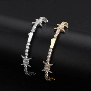 Iced out barbed wire tennis bracelets with pave set zircons in gold and silver finish