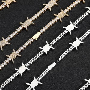 Close-up of hip-hop barbed wire tennis chain necklace with CZ stones in gold and silver