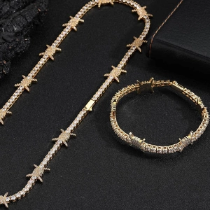 Detailed view of hip hop thorn chain necklace and bracelet set with sparkling zircons