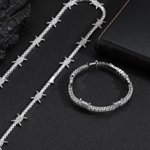 Detail of hip hop thorn link chain necklace and bracelet set with cubic zirconia stones