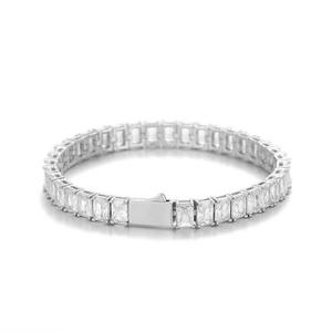 Macro shot of silver tennis bracelet with emerald-cut cubic zirconia and square clasp