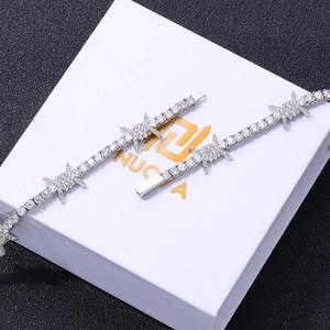 Detail of silver tennis chain with thorn accents and sparkling zircon stones on box