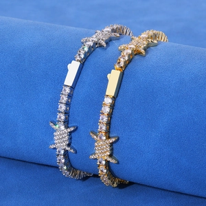 Gold and silver iced-out tennis bracelets with barbed wire design and zircon stones