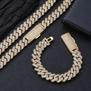Macro detail of 16mm gold hip hop Cuban link chain with dense zircon diamond pavé stones