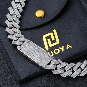 Macro shot of 16mm silver hip-hop Cuban link chain with zircon stones and a box clasp