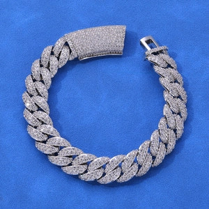 Macro view of 13mm iced-out moissanite Cuban link bracelet in 925 sterling silver