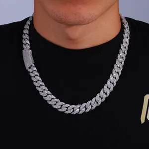 Detail of 13mm silver Cuban link chain featuring micro-paved moissanite on model neck