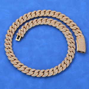 Detail of 13mm gold cuban link chain with double row of pavé set cubic zirconia stones