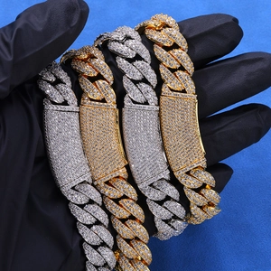 Macro view of iced-out 13mm Cuban link bracelets with sparkling moissanite in gold and silver