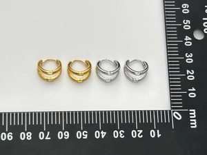 Detail of double-layered C-shaped hoop earrings with measurements showing 14mm diameter