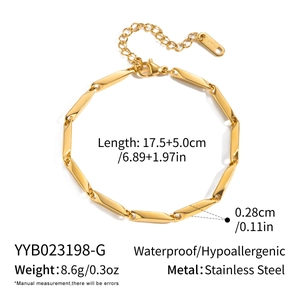 Detailed close-up of polished gold rhombus link bracelet with adjustable lobster clasp