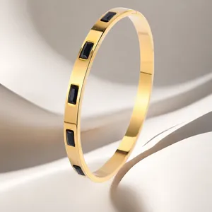 Elegant 18K gold plated titanium steel bangle with rectangular black zircon stones
