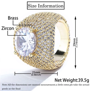 Macro side view of hip hop brass ring with large round zircon and iced out cubic zirconia