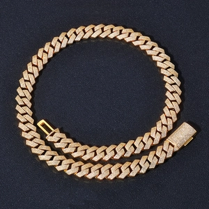 Close-up of 15mm gold Cuban link chain with four rows of sparkling pavé diamonds