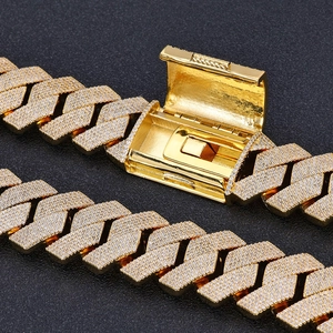 Detailed macro view of 26mm gold-plated cuban link chain with zircon box clasp mechanism