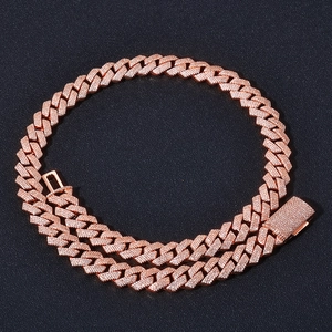 Macro detail of 15mm rose gold Cuban link necklace with four rows of paved zircon stones