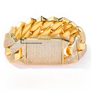 Close-up of 26mm Cuban chain bracelet with half-pave cubic zirconia and polished brass finish