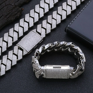Close-up of iced out silver Cuban link chain necklace and matching bracelet set