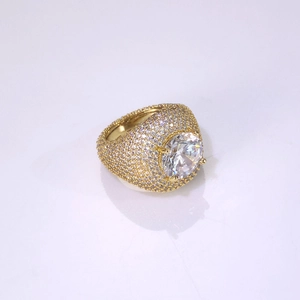 Macro shot of gold hip hop ring with pave set zircons and a large round center stone