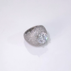 Macro shot of large round-cut zircon and iced-out micro-pave hip-hop ring for men
