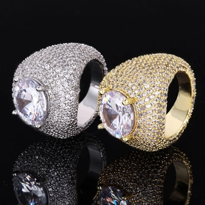 Hip hop style gold and silver rings with large oval cz center stones and pave setting