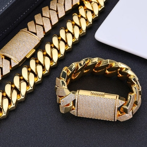 Detailed view of 26mm gold and diamond-encrusted Cuban link bracelet with hip-hop style
