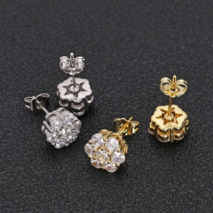 Detailed view of hip hop flower earrings with zircon clusters in gold and silver plating