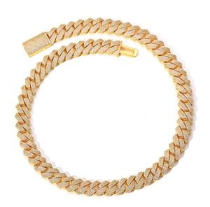 Detail of 15mm gold Cuban link necklace featuring micro-pave diamonds and secure box clasp