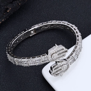 Macro shot of silver-tone Hamsa Hand bracelet with pave-set cubic zirconia stones