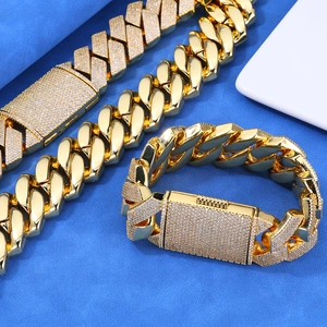 Close-up of gold hip hop Cuban chain set with pavé cubic zirconia and box clasp