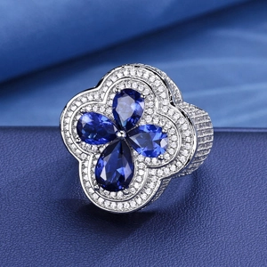 Luxurious S925 silver ring featuring blue flower moissanite stones and pavé diamonds