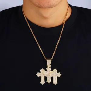 Detailed view of hip hop gold rope chain with triple cross iced-out zircon pendants