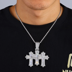 Triple cross hip hop pendant with cubic zirconia and twisted rope chain on model