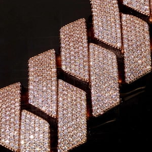 Macro close-up of rose gold Cuban link bracelet featuring dense pavé-set zircon stones